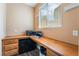 Bright office space with custom wooden desk and ample natural light from the window at 11285 Fiesole St, Las Vegas, NV 89141
