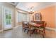 Charming dining room with wood table, shutters and natural light at 11405 Perugino Dr, Las Vegas, NV 89138