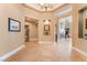 Spacious foyer with tile flooring, decorative niches, and a view of the living areas at 11405 Perugino Dr, Las Vegas, NV 89138