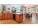 Spacious kitchen with granite countertops, wood cabinets, breakfast bar and dining area at 11405 Perugino Dr, Las Vegas, NV 89138