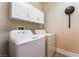 Bright laundry room featuring a washing machine and dryer at 11405 Perugino Dr, Las Vegas, NV 89138