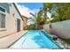 Tranquil backyard retreat with a refreshing pool, lush greenery, and plenty of sunshine at 11405 Perugino Dr, Las Vegas, NV 89138