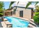 Private backyard oasis featuring a sparkling pool, palm trees, and serene outdoor space at 11405 Perugino Dr, Las Vegas, NV 89138