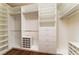 Spacious walk-in closet with custom shelving and drawers, providing ample storage and organization space at 11405 Perugino Dr, Las Vegas, NV 89138