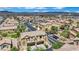 Exterior aerial showing property with desert landscaping, and neighborhood at 1185 Via Dimartini, Henderson, NV 89052