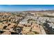 Expansive aerial view of a modern, well-planned community with mountain views and diverse architectural styles at 1185 Via Dimartini, Henderson, NV 89052