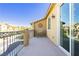 Relaxing outdoor balcony with space for seating, offering a private neighborhood view at 1185 Via Dimartini, Henderson, NV 89052