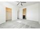 Bedroom with a closet and a doorway to the bathroom, complete with gray carpet at 1185 Via Dimartini, Henderson, NV 89052