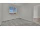 This bright bedroom features a modern window with views of the neighborhood at 1185 Via Dimartini, Henderson, NV 89052
