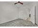 A bedroom with neutral-toned walls, carpet, and a ceiling fan for comfort at 1185 Via Dimartini, Henderson, NV 89052