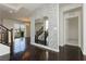 Stylish entryway featuring a mosaic wall design and dark wood flooring at 1185 Via Dimartini, Henderson, NV 89052