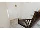 Bright entryway with tile floors, white walls, and a staircase with dark wood railing at 1185 Via Dimartini, Henderson, NV 89052