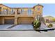 Charming two-story home with a two-car garage, a small balcony and well-kept landscaping at 1185 Via Dimartini, Henderson, NV 89052