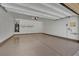 Spacious two-car garage featuring epoxy flooring, ample storage, and access door at 1185 Via Dimartini, Henderson, NV 89052