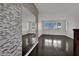 Hallway features modern wall mirror and dark wood flooring at 1185 Via Dimartini, Henderson, NV 89052