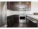 Well-equipped kitchen featuring stainless steel appliances and granite countertops at 1185 Via Dimartini, Henderson, NV 89052