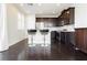 Charming kitchenette with stainless steel appliances and breakfast bar seating at 1185 Via Dimartini, Henderson, NV 89052