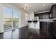 Cozy kitchenette with stainless steel appliances and convenient breakfast bar seating at 1185 Via Dimartini, Henderson, NV 89052