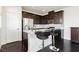 Stylish kitchenette with stainless steel appliances and breakfast bar at 1185 Via Dimartini, Henderson, NV 89052