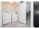 Functional laundry area with washer, dryer, and storage, making chores easier at 1185 Via Dimartini, Henderson, NV 89052