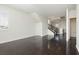 Open-concept living room with hardwood floors and lots of natural light at 1185 Via Dimartini, Henderson, NV 89052