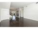 Bright, open-concept living space with dark wood floors and natural light at 1185 Via Dimartini, Henderson, NV 89052