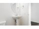 Clean powder room with pedestal sink and modern fixtures at 1185 Via Dimartini, Henderson, NV 89052