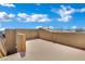 Spacious roof deck boasting stunning views of a clear blue sky and neighboring rooftops for entertainment and relaxation at 1185 Via Dimartini, Henderson, NV 89052