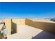 Spacious rooftop deck with stucco wall surrounds, perfect for outdoor relaxation at 1185 Via Dimartini, Henderson, NV 89052