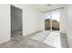 Inviting room featuring bright natural light, neutral walls, and a sliding glass door to the patio at 1185 Via Dimartini, Henderson, NV 89052