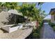 Backyard garden featuring decorative raised planters, hardscape, and landscape at 12318 Tudor Arch Dr, Las Vegas, NV 89138