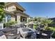 Backyard oasis featuring a fire pit, lush landscaping, and mountain views at 12318 Tudor Arch Dr, Las Vegas, NV 89138