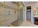 Walk-in shower with a view into the walk-in closet in the main bathroom at 12318 Tudor Arch Dr, Las Vegas, NV 89138