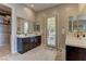 Dual vanities and walk-in closet featured in the main bathroom at 12318 Tudor Arch Dr, Las Vegas, NV 89138