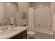 Cozy bathroom with shower and bath combination and wood vanity, offering comfort and practicality at 12318 Tudor Arch Dr, Las Vegas, NV 89138