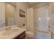 Bright bathroom featuring a shower over tub, a modern vanity with a white countertop, and neutral wall colors at 12318 Tudor Arch Dr, Las Vegas, NV 89138