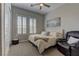 Bright bedroom with a neutral color scheme, comfortable bed and stylish furnishings, offering a relaxing retreat at 12318 Tudor Arch Dr, Las Vegas, NV 89138