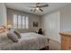 Comfortable bedroom with neutral colors, soft carpet, and ample natural light offering a calm and peaceful environment at 12318 Tudor Arch Dr, Las Vegas, NV 89138