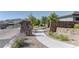 Stone entrance to Shadow Point neighborhood with landscaped walkway at 12318 Tudor Arch Dr, Las Vegas, NV 89138