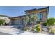 Stunning single-story home with a three-car garage and well-maintained landscaping at 12318 Tudor Arch Dr, Las Vegas, NV 89138
