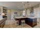 Bright kitchen featuring a spacious island with bar seating, stainless appliances, and open layout at 12318 Tudor Arch Dr, Las Vegas, NV 89138
