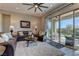 Cozy living room features large glass doors that lead to the outdoor patio at 12318 Tudor Arch Dr, Las Vegas, NV 89138