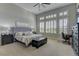 Vaulted ceilings and plantation shutters add elegance to this main bedroom at 12318 Tudor Arch Dr, Las Vegas, NV 89138