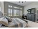 Comfortable main bedroom with plantation shutters allowing natural light to enter the room at 12318 Tudor Arch Dr, Las Vegas, NV 89138