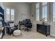 Bright office space with large windows, neutral tones, and a comfortable seating area and desk at 12318 Tudor Arch Dr, Las Vegas, NV 89138