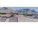 Rooftop shot showcasing neighborhood homes, tile roofs and mountain views at 12318 Tudor Arch Dr, Las Vegas, NV 89138