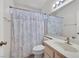 Bathroom featuring shower with floral curtain and white vanity at 1356 Pleasant Brook St, Las Vegas, NV 89142
