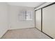 Simple bedroom with neutral carpet, a window, and closet at 1356 Pleasant Brook St, Las Vegas, NV 89142