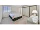 Cozy bedroom featuring a queen-size bed, carpeted floors, and a mirrored closet at 1356 Pleasant Brook St, Las Vegas, NV 89142