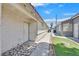 Side view of the home with a walkway and low-maintenance landscaping, leading to the entrance at 1356 Pleasant Brook St, Las Vegas, NV 89142